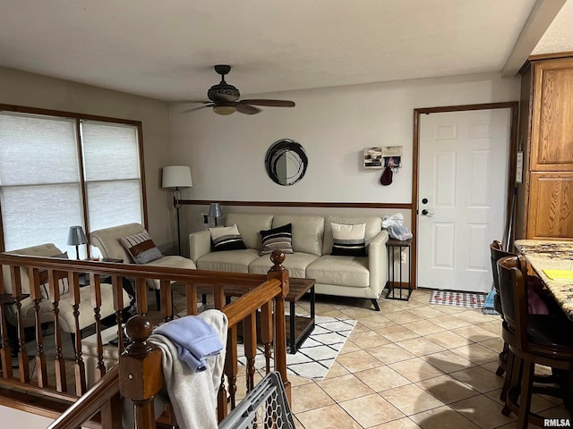 living room featuring ceiling fan and light tile patterned flooring