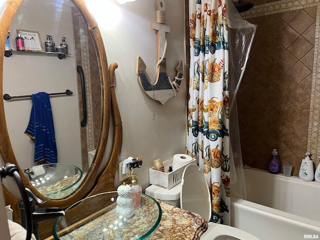 bathroom with shower / tub combo and vanity