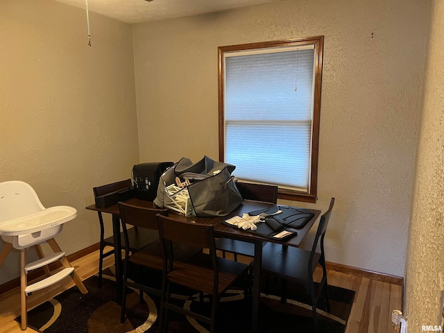 dining area with wood-type flooring