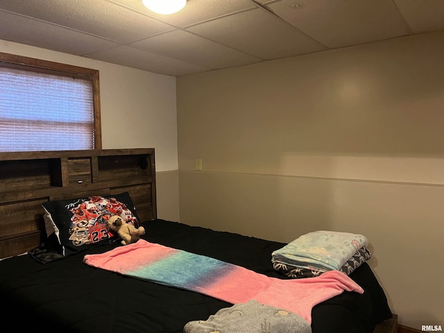 bedroom with a paneled ceiling