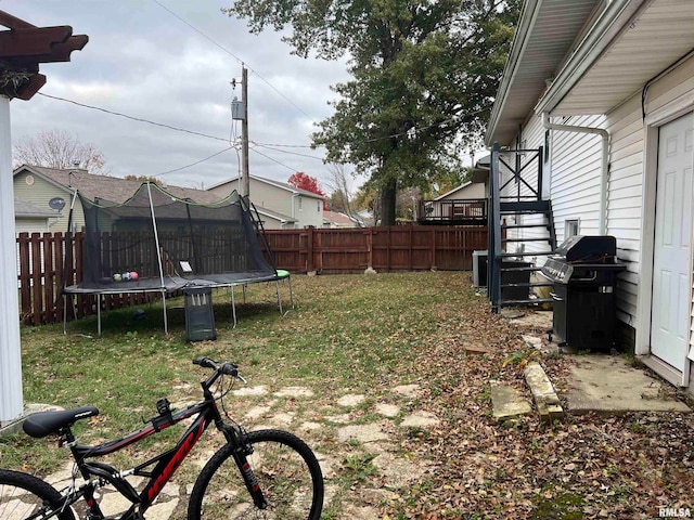 view of yard featuring a trampoline