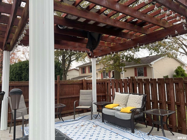 view of patio featuring an outdoor living space and a pergola