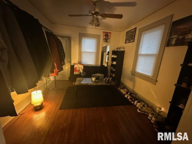 misc room featuring wood-type flooring and ceiling fan