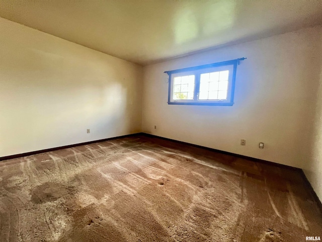 unfurnished room with carpet