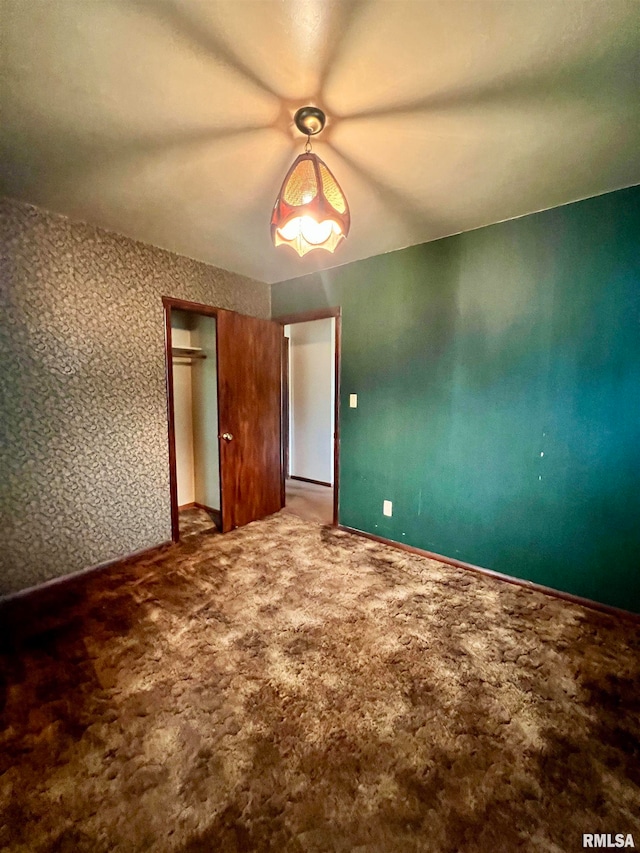 unfurnished bedroom with carpet