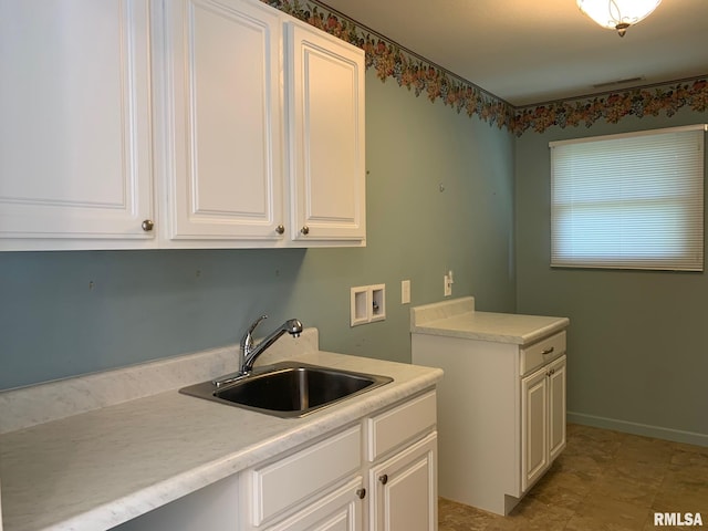 laundry area featuring cabinets, sink, and hookup for a washing machine