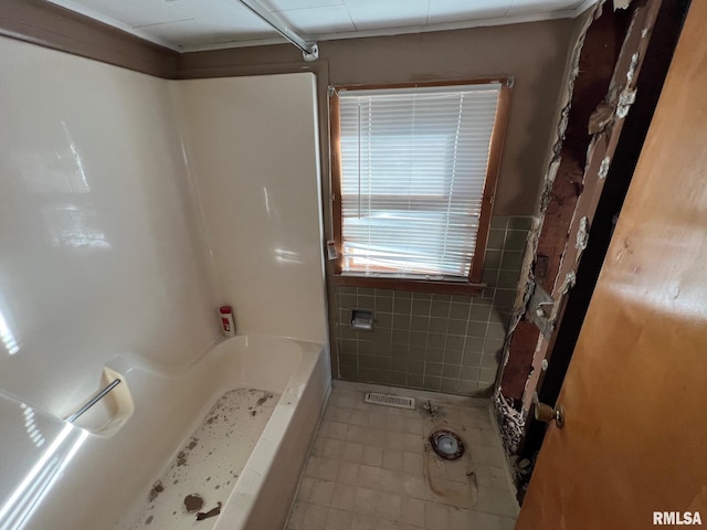 617 Short 8th St, Lincoln, IL 62656 - bathroom with tile walls and tile patterned floors