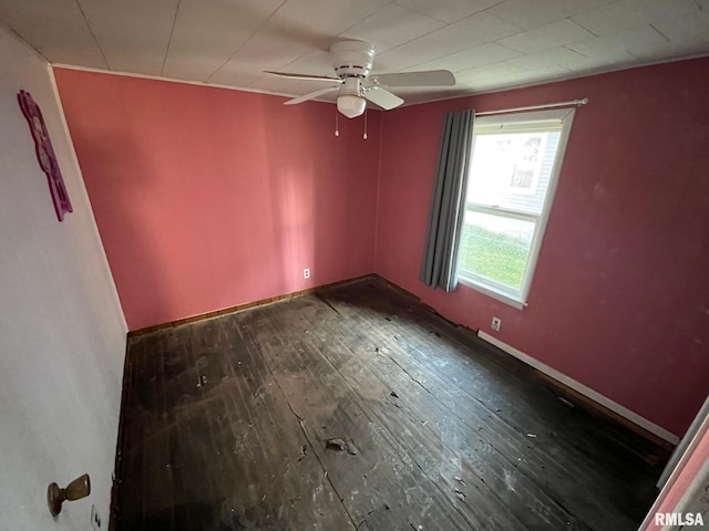 spare room with hardwood / wood-style flooring and ceiling fan