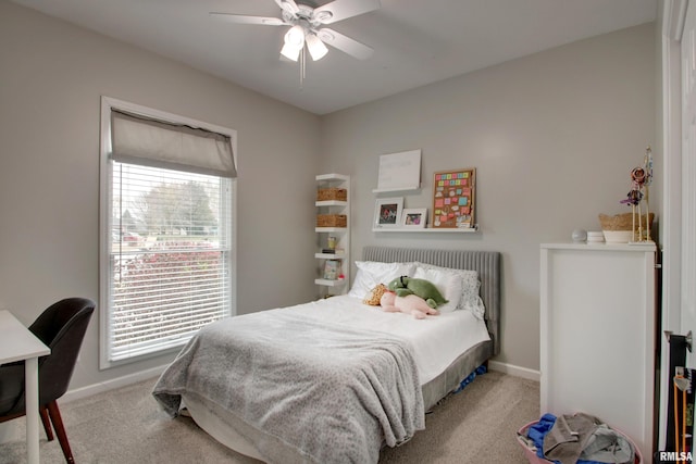 bedroom featuring ceiling fan and light colored carpet