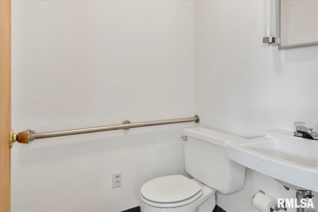 bathroom with toilet and sink