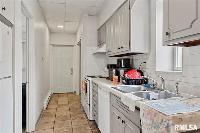 kitchen featuring white cabinetry, sink, light tile patterned floors, white appliances, and a baseboard radiator