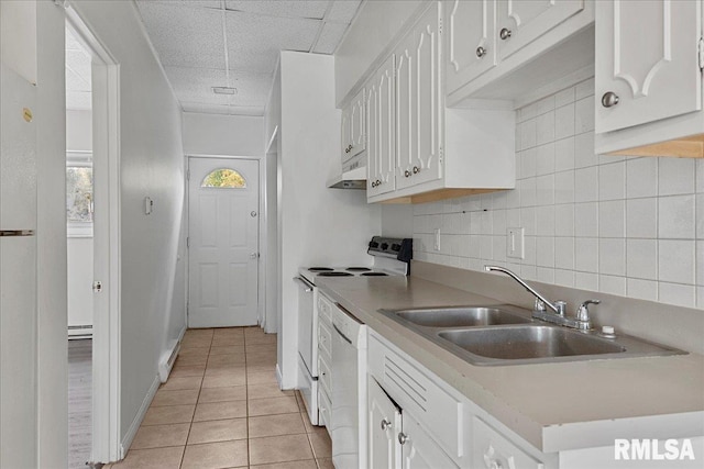 kitchen with white cabinets, light tile patterned flooring, dishwashing machine, and electric range oven