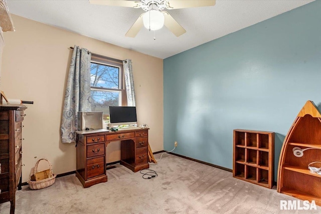 office area with ceiling fan and light carpet