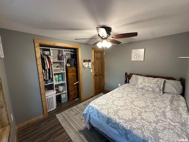 bedroom featuring dark wood-type flooring, a closet, and ceiling fan