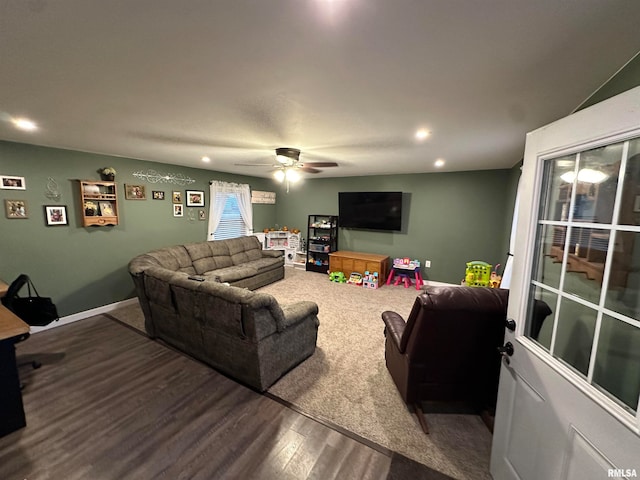 living room with hardwood / wood-style floors and ceiling fan