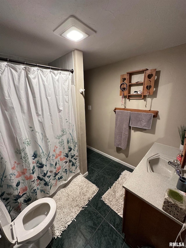 bathroom featuring a shower with curtain, a textured ceiling, vanity, tile patterned floors, and toilet