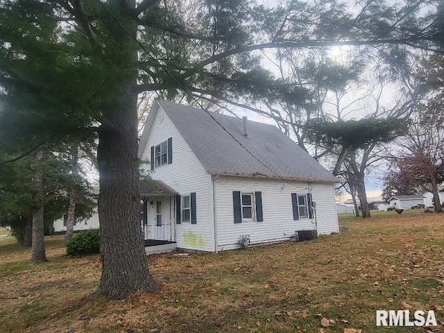 view of side of home with covered porch