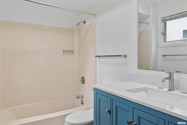 full bathroom with vanity, toilet, and  shower combination