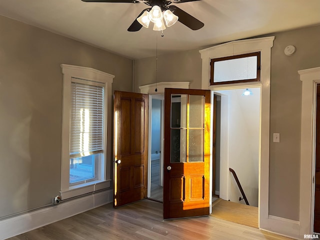 unfurnished bedroom featuring ceiling fan and hardwood / wood-style flooring