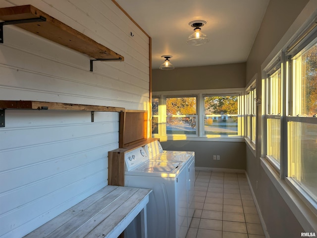 washroom featuring separate washer and dryer and light tile patterned floors