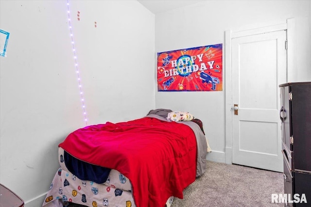 bedroom featuring light colored carpet