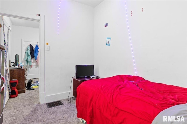 bedroom featuring light colored carpet