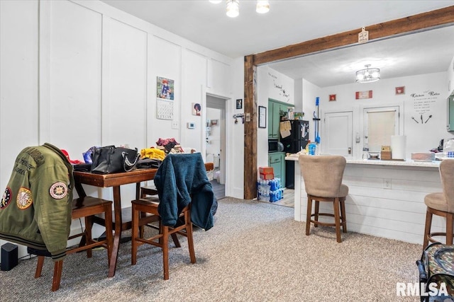 dining room with light colored carpet