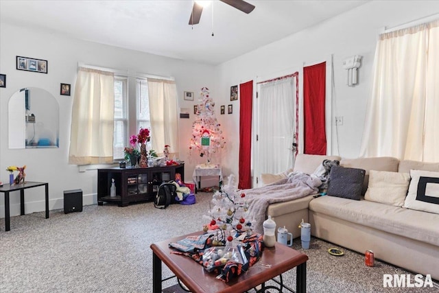 living room featuring ceiling fan and carpet floors