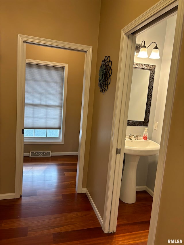 hallway with dark wood-type flooring