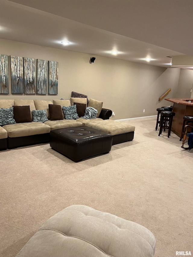 living room with bar area and carpet floors