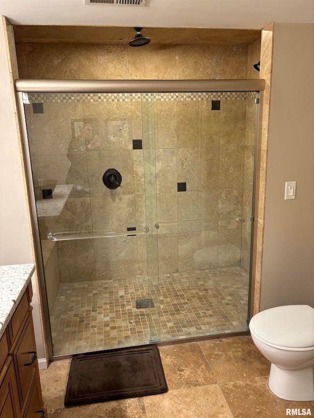 bathroom featuring walk in shower and vanity