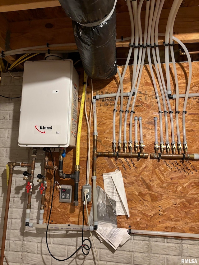 utility room featuring water heater