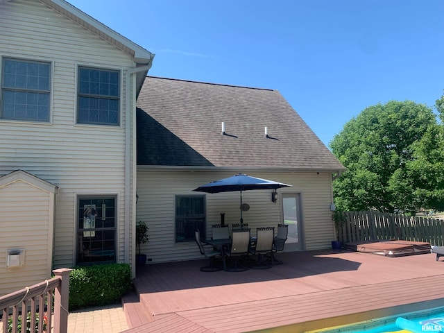 back of property featuring a wooden deck