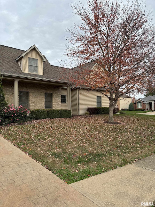 view of home's exterior featuring a lawn