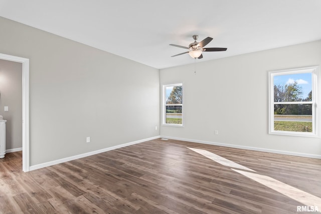 unfurnished room with ceiling fan and wood-type flooring