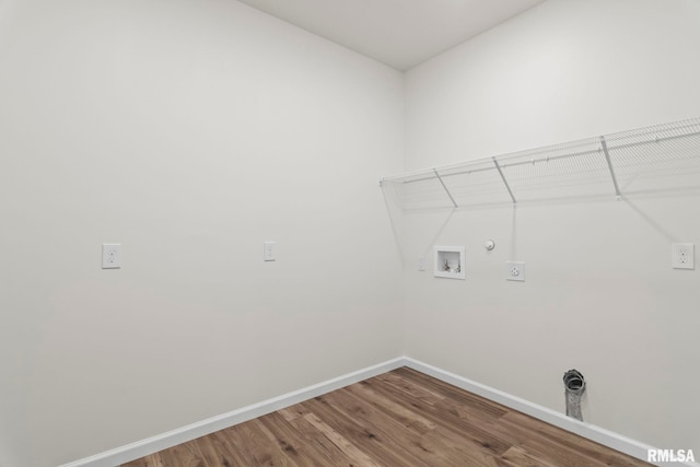 laundry room with hookup for a gas dryer, hardwood / wood-style floors, washer hookup, and hookup for an electric dryer