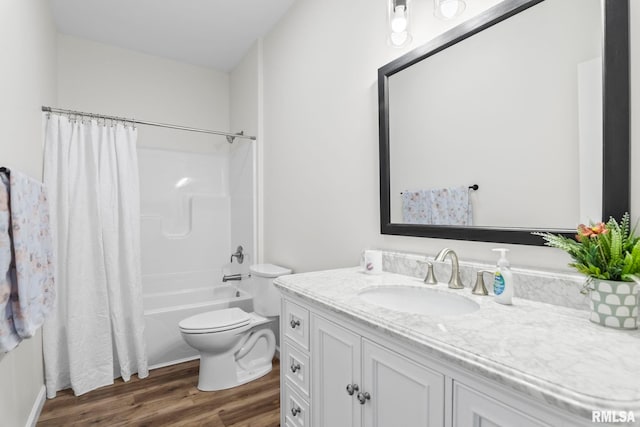 full bathroom featuring toilet, shower / tub combo with curtain, vanity, and hardwood / wood-style flooring