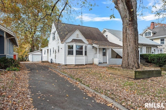 view of front of home featuring an outbuilding and a garage