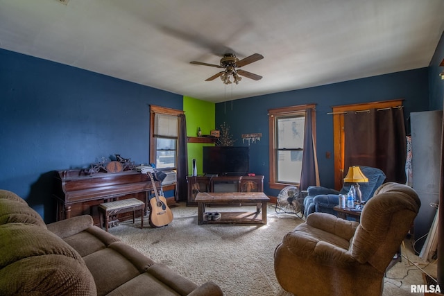 carpeted living room featuring ceiling fan and plenty of natural light