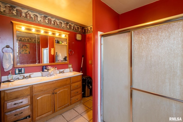 bathroom featuring vanity, tile patterned floors, and walk in shower