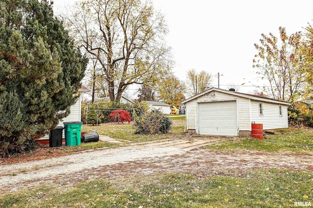 exterior space with a garage and an outdoor structure