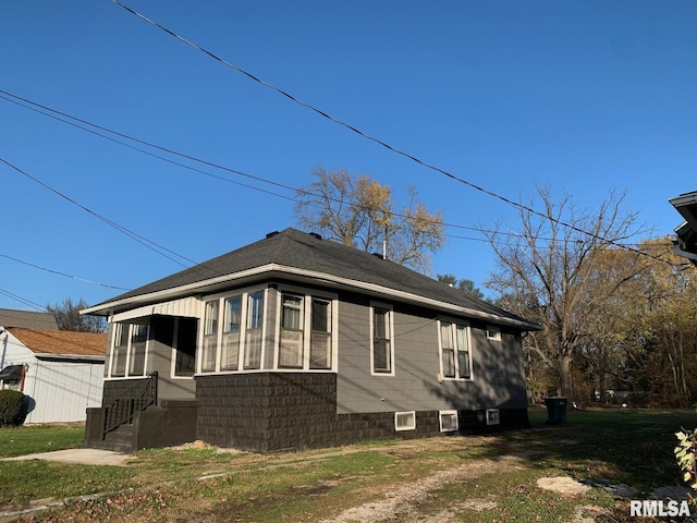 view of home's exterior with a lawn