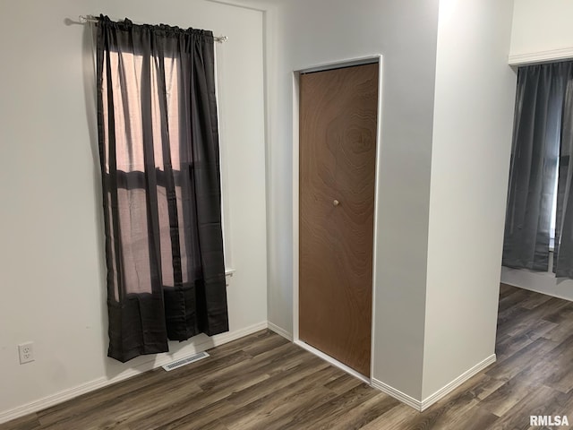 interior space featuring dark wood-type flooring