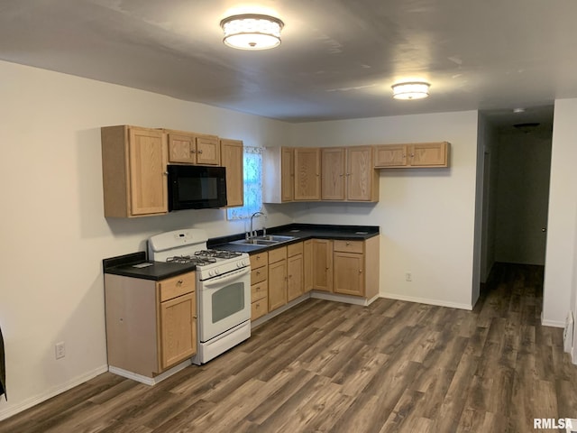 kitchen with light brown cabinets, dark hardwood / wood-style flooring, white range with gas cooktop, and sink