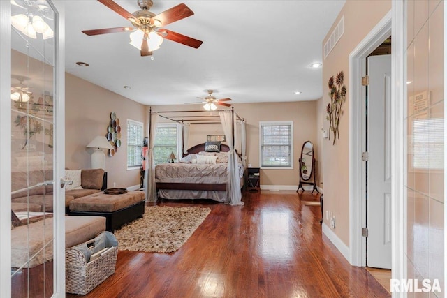 bedroom featuring hardwood / wood-style flooring and ceiling fan