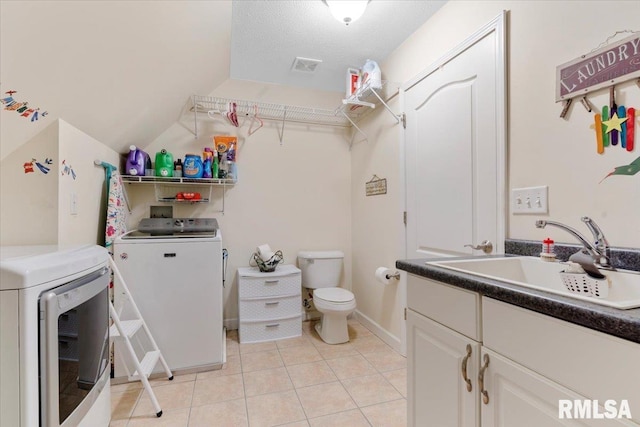 13599 Woodland Dr, Athens, IL 62613 - washroom with washing machine and clothes dryer, light tile patterned floors, and baseboards
