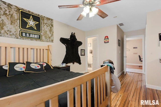 bedroom with wood-type flooring and ceiling fan