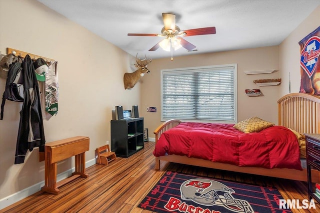 bedroom featuring ceiling fan and wood-type flooring