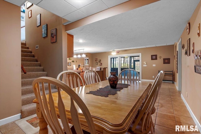 13599 Woodland Dr, Athens, IL 62613 - dining space featuring light tile patterned floors, stairs, baseboards, and ceiling fan