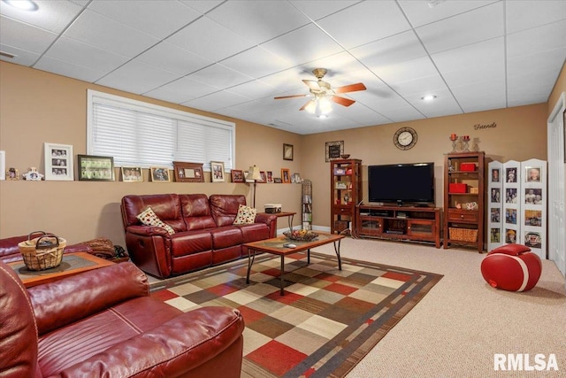 carpeted living room featuring ceiling fan